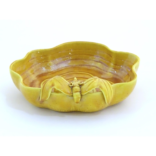 18 - A Chinese fluted edged yellow brush wash dish with relief bat and fruit decoration. Character marks ... 