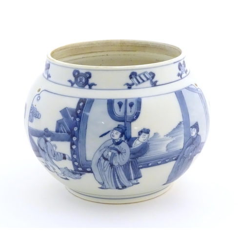 35 - A Chinese blue and white planter with four drilled hanging holes, decorated with panelled decoration... 