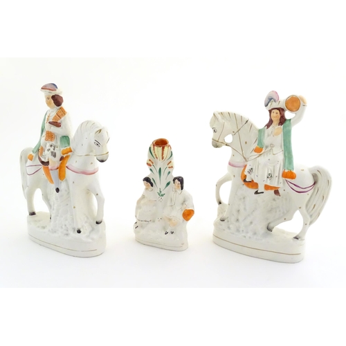 94 - Three Victorian Staffordshire figures depicting male and female Scottish figures on horseback, and a... 