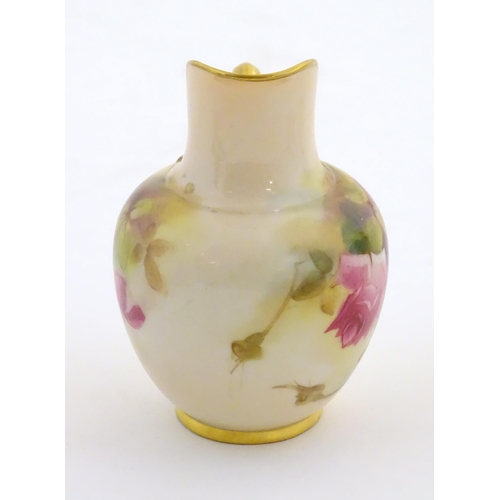 144 - A Royal Worcester flatback jug with a shaped spout, with painted decoration depicting rose flowers a... 