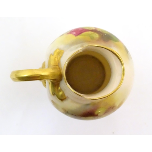 144 - A Royal Worcester flatback jug with a shaped spout, with painted decoration depicting rose flowers a... 