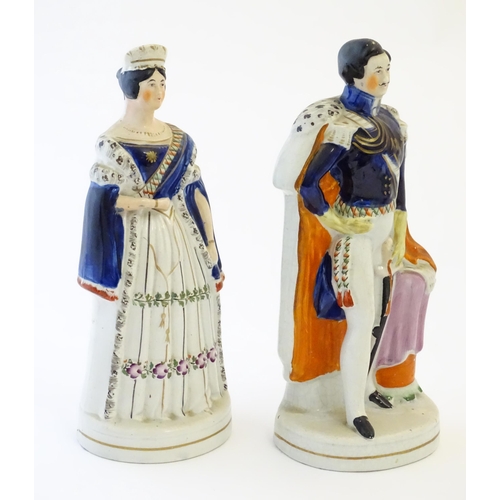 102 - Two Victorian Staffordshire pottery figures depicting Queen Victoria, and Prince Albert. Largest app... 