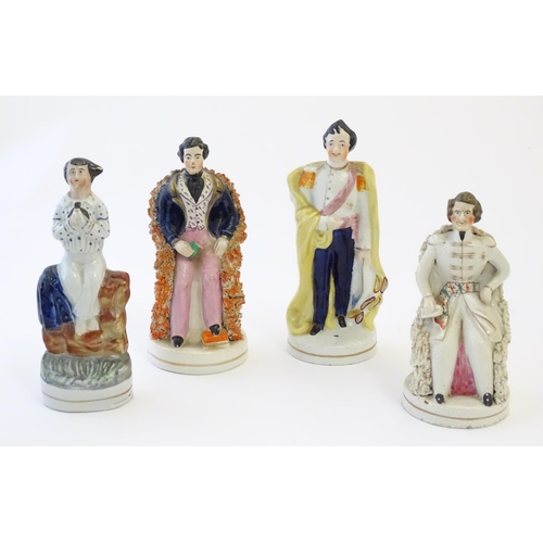 110 - Three Staffordshire pottery figures depicting Prince Albert, one standing, one seated wearing a tuni... 