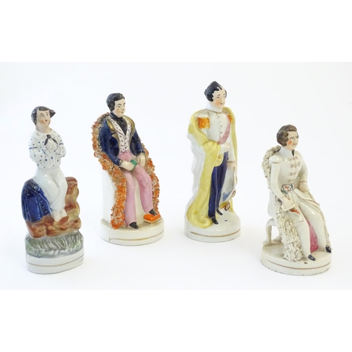 110 - Three Staffordshire pottery figures depicting Prince Albert, one standing, one seated wearing a tuni... 