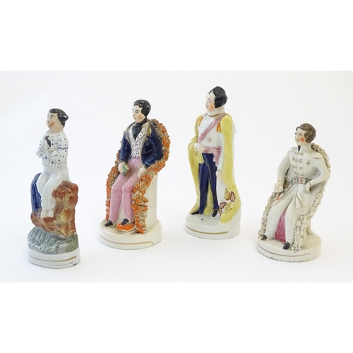 110 - Three Staffordshire pottery figures depicting Prince Albert, one standing, one seated wearing a tuni... 