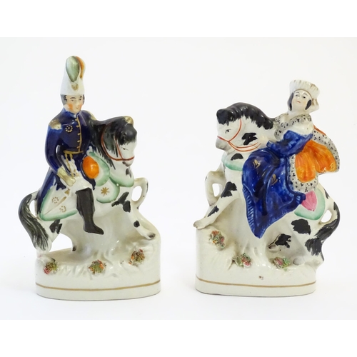 111 - A pair of Victorian Staffordshire pottery figures depicting Albert and Victoria on horseback. Larges... 