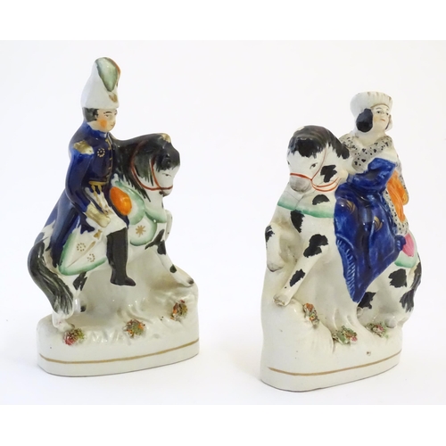 111 - A pair of Victorian Staffordshire pottery figures depicting Albert and Victoria on horseback. Larges... 