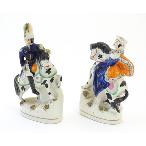 111 - A pair of Victorian Staffordshire pottery figures depicting Albert and Victoria on horseback. Larges... 