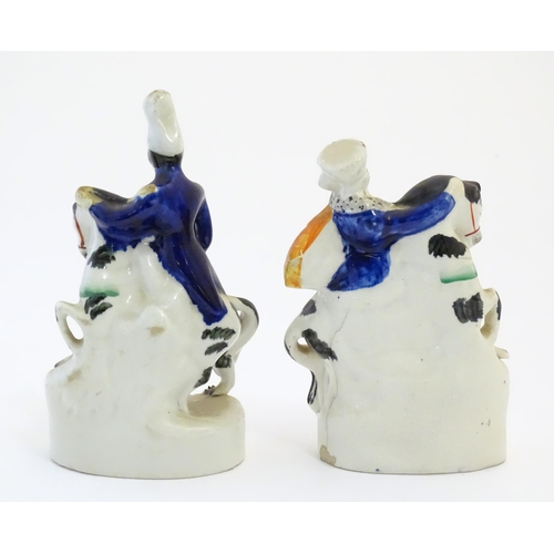 111 - A pair of Victorian Staffordshire pottery figures depicting Albert and Victoria on horseback. Larges... 