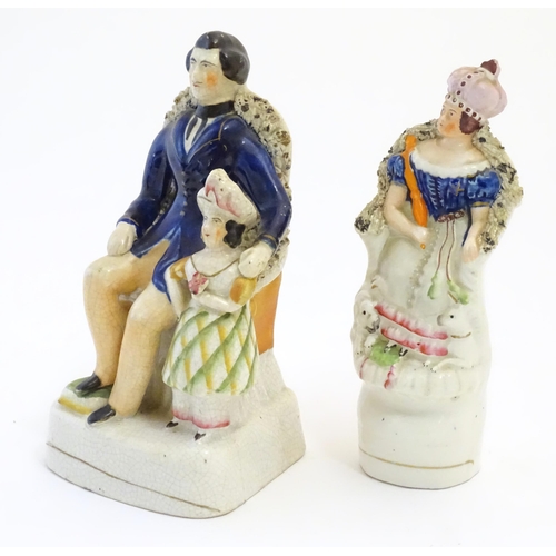 113 - A Victorian Staffordshire pottery figural group depicting Albert seated with the Prince of Wales, to... 