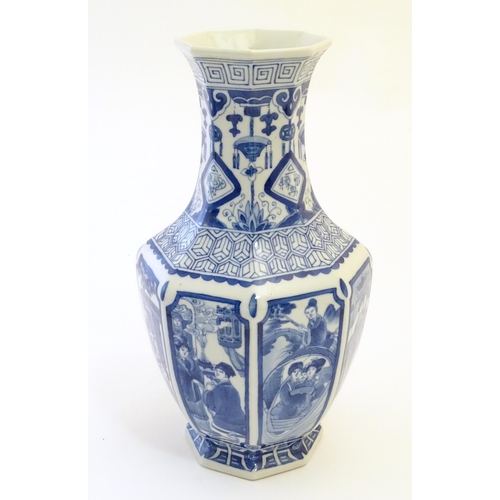 57 - A Chinese blue and white vase of octagonal form with panelled decoration depicting various figures, ... 