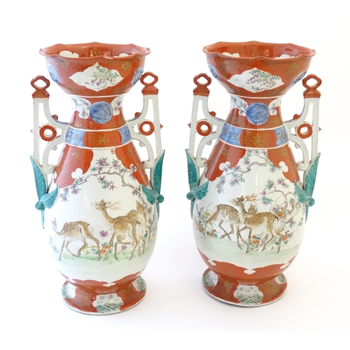 65 - A pair of Japanese vases with flared scallop edge rims and twin pierced handles with relief foliate ... 