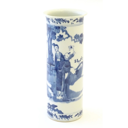 70 - A Chinese blue and white vase of cylindrical form decorated with figures in a garden landscape with ... 