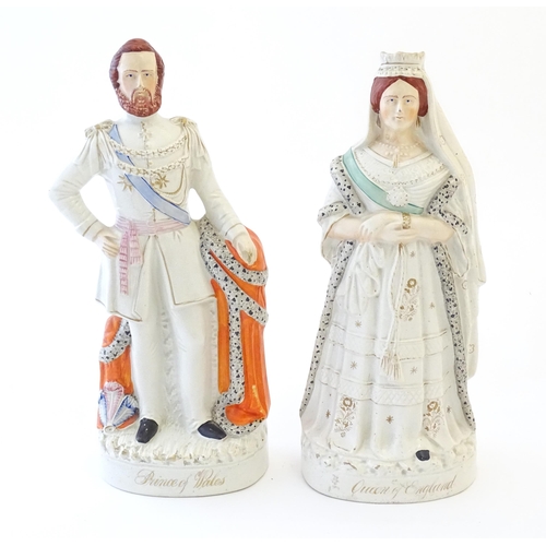 87 - A pair of large Victorian Staffordshire pottery flat back figures depicting the Queen of England, an... 