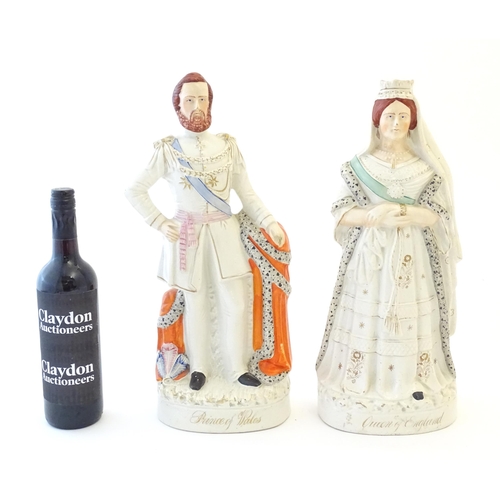 87 - A pair of large Victorian Staffordshire pottery flat back figures depicting the Queen of England, an... 