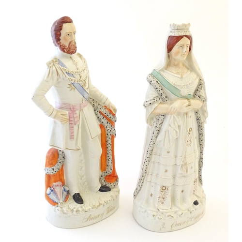 87 - A pair of large Victorian Staffordshire pottery flat back figures depicting the Queen of England, an... 