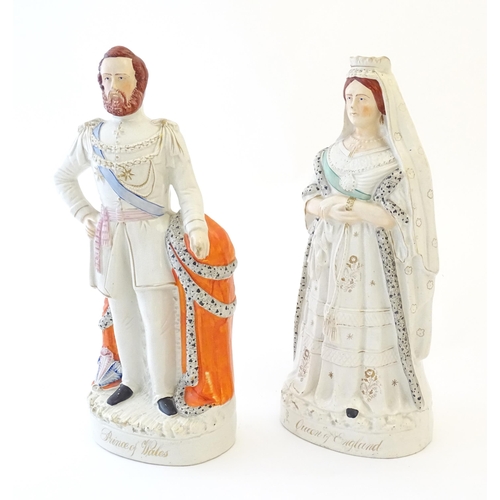 87 - A pair of large Victorian Staffordshire pottery flat back figures depicting the Queen of England, an... 