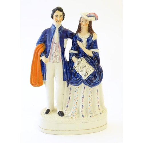 90 - A large Victorian Staffordshire pottery flat back figural group depicting a young couple, possibly P... 