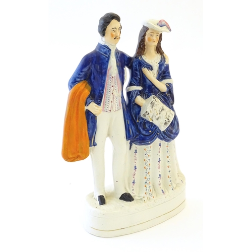 90 - A large Victorian Staffordshire pottery flat back figural group depicting a young couple, possibly P... 