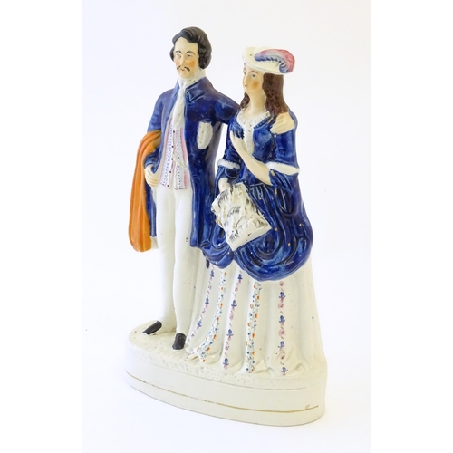 90 - A large Victorian Staffordshire pottery flat back figural group depicting a young couple, possibly P... 