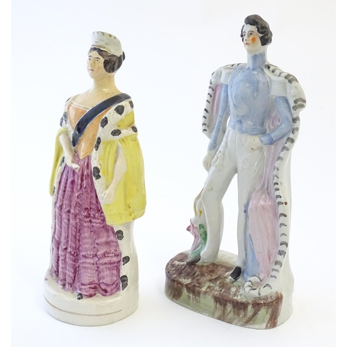 97 - Two Victorian Staffordshire pottery figures depicting Prince Albert, and Queen Victoria. Largest app... 