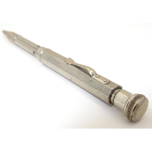 417 - 3 Propelling pencils : A Sterling silver pencil with engine turned decoration by Yard O Led, patent ... 