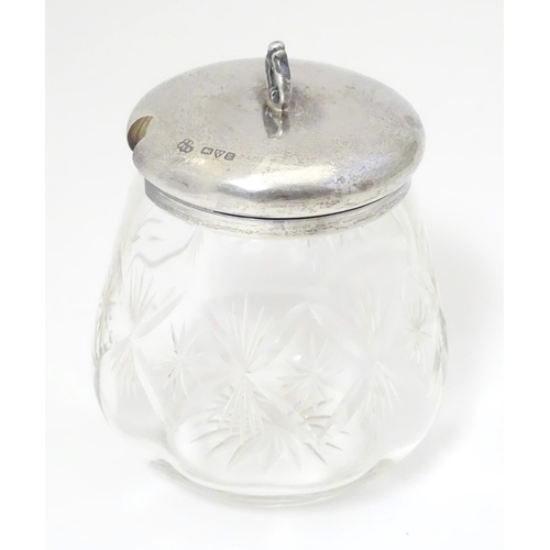 448 - A cut glass jam / preserve pot with silver top hallmarked Chester 1925 maker Barker Brothers togethe... 
