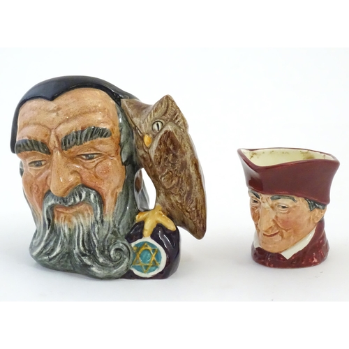145 - A Royal Doulton small character jug modelled as Merlin, marked under D6536. Together with model of a... 