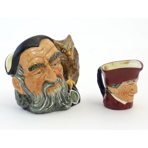 145 - A Royal Doulton small character jug modelled as Merlin, marked under D6536. Together with model of a... 
