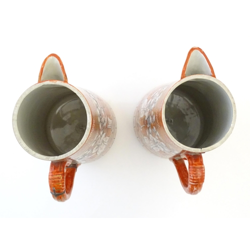 84 - A pair of Japanese Kutani jugs decorated with a crowd of scholars. Character marks under. Approx. 10... 