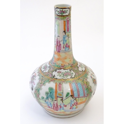 78 - A Chinese / Cantonese bottle vase with panelled decoration depicting figures on a garden terrace, fl... 