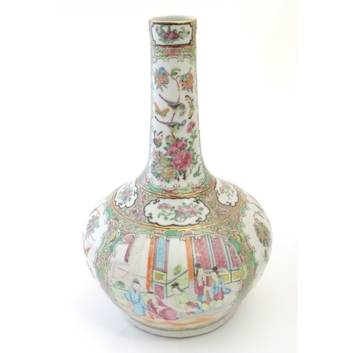 78 - A Chinese / Cantonese bottle vase with panelled decoration depicting figures on a garden terrace, fl... 