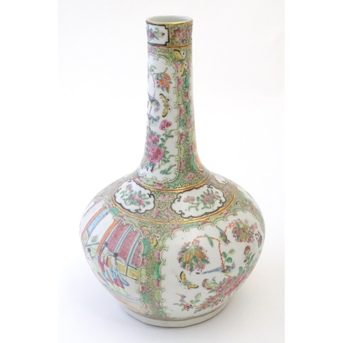 78 - A Chinese / Cantonese bottle vase with panelled decoration depicting figures on a garden terrace, fl... 