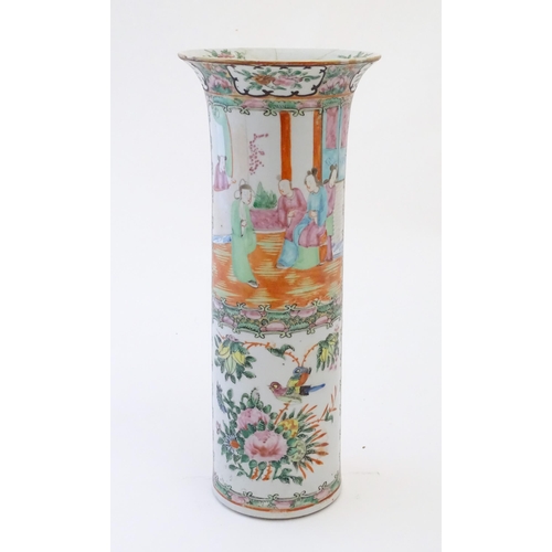 79 - A Chinese / Cantonese vase of cylindrical form with a flared rim decorated with figures, birds, flow... 