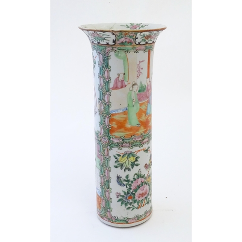 79 - A Chinese / Cantonese vase of cylindrical form with a flared rim decorated with figures, birds, flow... 