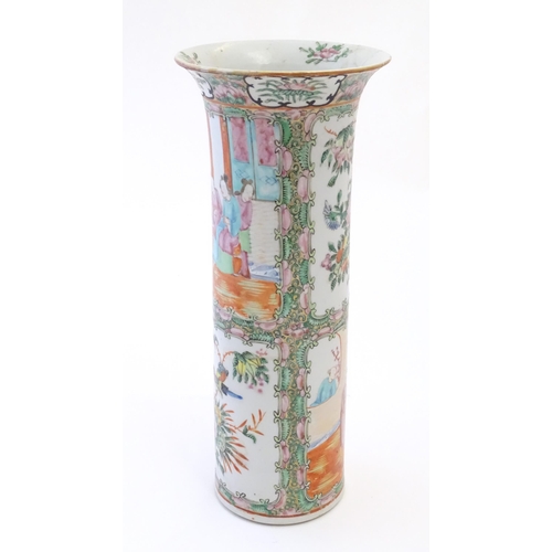 79 - A Chinese / Cantonese vase of cylindrical form with a flared rim decorated with figures, birds, flow... 