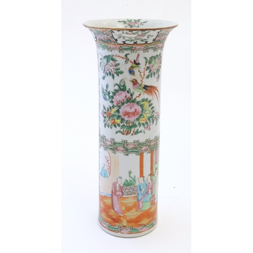 79 - A Chinese / Cantonese vase of cylindrical form with a flared rim decorated with figures, birds, flow... 