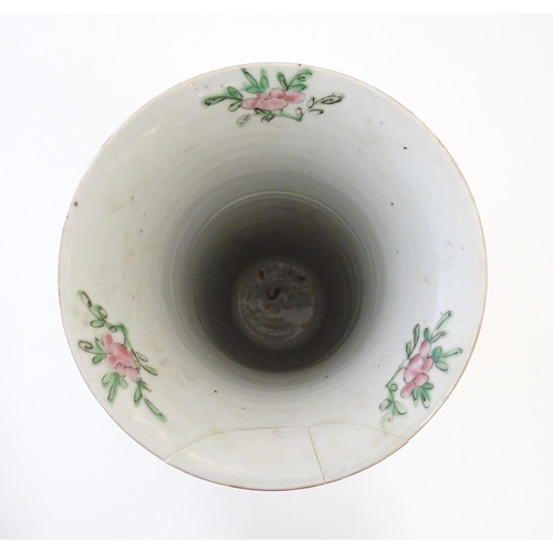 79 - A Chinese / Cantonese vase of cylindrical form with a flared rim decorated with figures, birds, flow... 