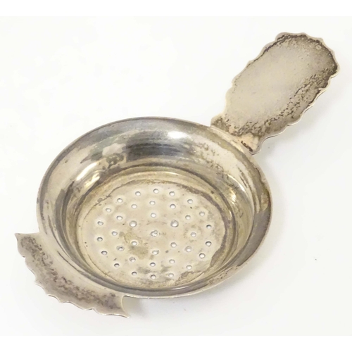 435 - A silver strainer hallmarked Birmingham 1906 maker Kemp Brothers. 4 1/2