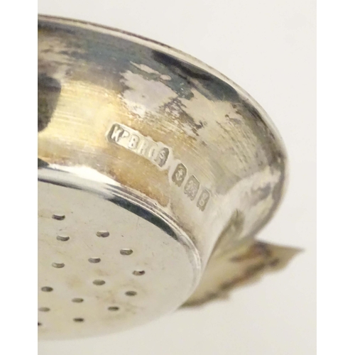435 - A silver strainer hallmarked Birmingham 1906 maker Kemp Brothers. 4 1/2