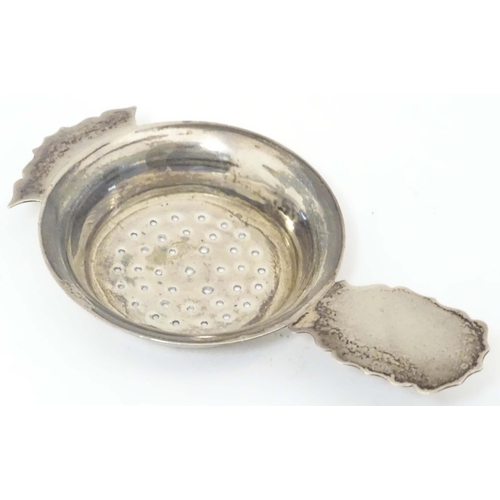 435 - A silver strainer hallmarked Birmingham 1906 maker Kemp Brothers. 4 1/2