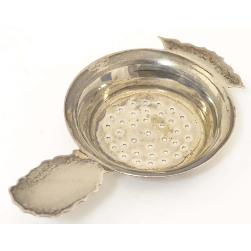 435 - A silver strainer hallmarked Birmingham 1906 maker Kemp Brothers. 4 1/2
