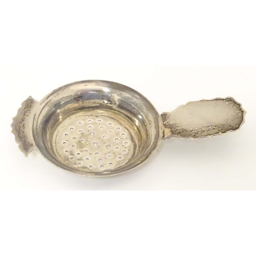 435 - A silver strainer hallmarked Birmingham 1906 maker Kemp Brothers. 4 1/2