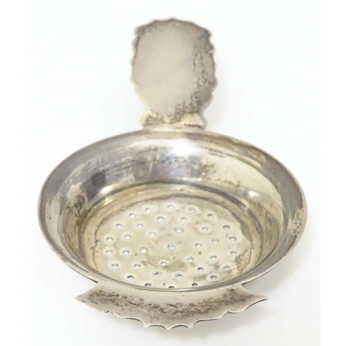 435 - A silver strainer hallmarked Birmingham 1906 maker Kemp Brothers. 4 1/2