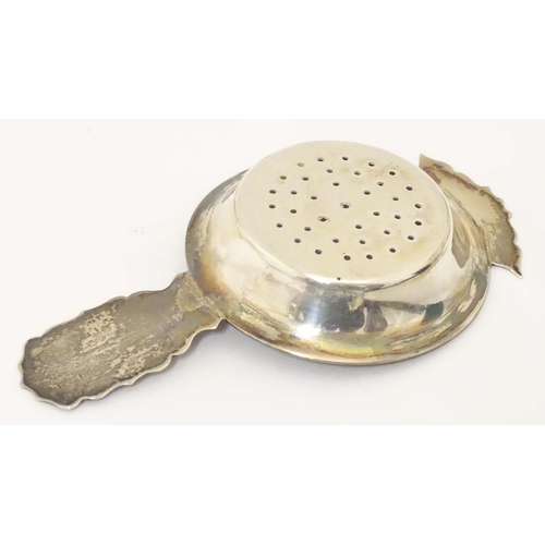 435 - A silver strainer hallmarked Birmingham 1906 maker Kemp Brothers. 4 1/2