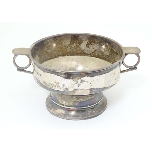 439 - A silver porringer with twin handles hallmarked Sheffield 1913 maker James Dixon & Sons Ltd. 6 1/2