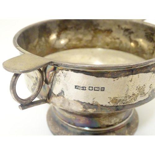 439 - A silver porringer with twin handles hallmarked Sheffield 1913 maker James Dixon & Sons Ltd. 6 1/2