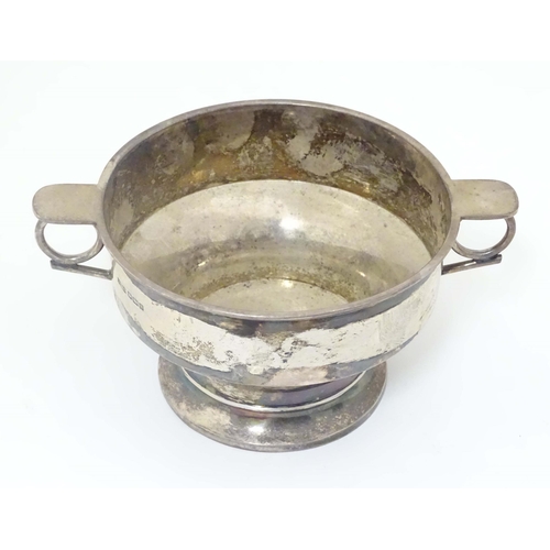 439 - A silver porringer with twin handles hallmarked Sheffield 1913 maker James Dixon & Sons Ltd. 6 1/2