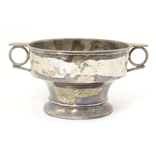 439 - A silver porringer with twin handles hallmarked Sheffield 1913 maker James Dixon & Sons Ltd. 6 1/2