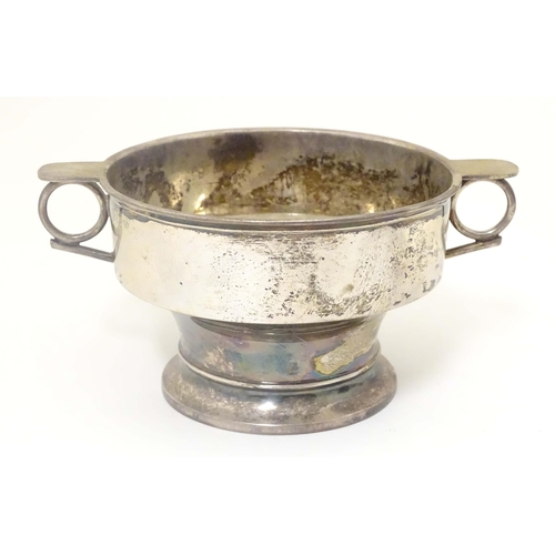 439 - A silver porringer with twin handles hallmarked Sheffield 1913 maker James Dixon & Sons Ltd. 6 1/2